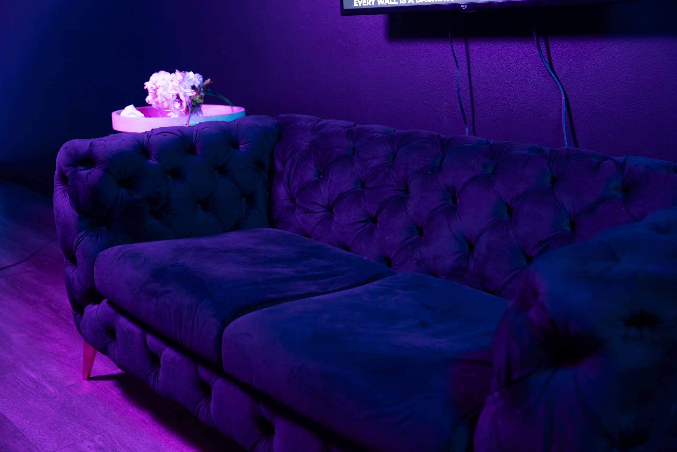 Velvet sectional lounge at Lush Event Space with fresh flowers