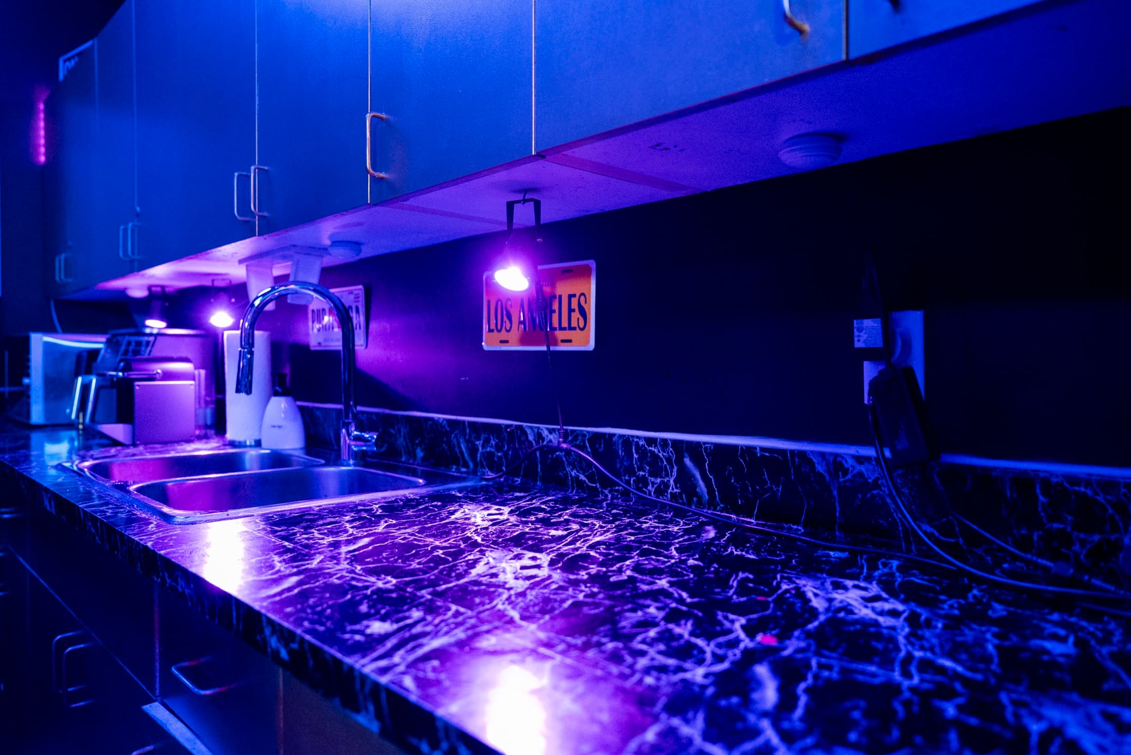 Prep kitchen at Lush Event Space — marble counter, sink and coffee station